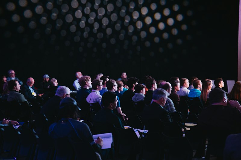 An audience listening at an association conference